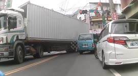 WTF MOMENT: Truck driver hits power lines almost causes moped rider to crash (Dashcam Video)