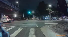 CLOSE CALL: Moped rider sped through traffic lights and almost hit ambulance (Dashcam Video)