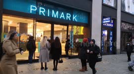 First Black Friday shoppers queue outside Primark as they await Oxford Street store to open