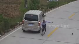 Minibus narrowly misses Chinese pedestrian but sends his shoe flying