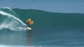 Delivery guy hands out pizza boxes while surfing in Bali, Indonesia