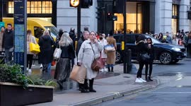 Scores of Black Friday shoppers in London's Regent Street, undeterred by the cold, rain or tube strikes