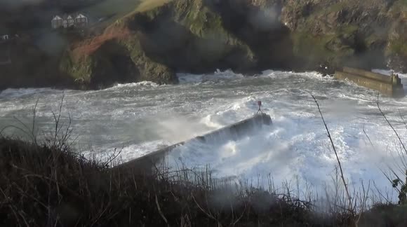 Storm Arwen whips up giant waves in Cornwall as power outage hits the region
