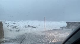 Powerful Storm Arwen brings blanket of sea foam to Banff in Scotland