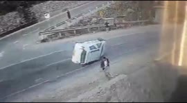 Narrow escape for pedestrians as car skids on its side across frozen road in India