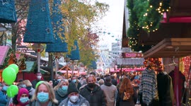 People on German Christmas market with face masks during corona virus pandemic