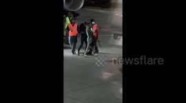 Woman detained after running onto tarmac attempting to wave down airplane at LAX