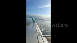 Huge column of smoke generated by factory fire seen from passing airplane in Chile