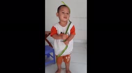 Vietnamese  four-year-old boy has a hobby of playing with snakes