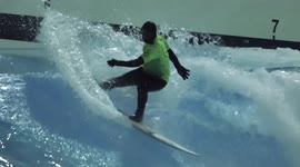 Those aren't snowboards! Swiss surfers practice in open air pool during snowstorm