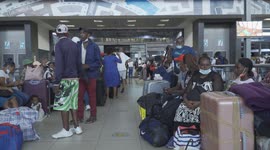 Travellers stuck in Johannesburg, South Africa after a new covid-19 strain, omicron is discovered. international Travel bans cause major delays.