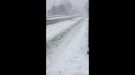 Cars driving in blizzard conditions Scotland snow storm