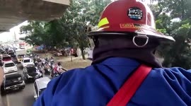 Hero firemen rescue kitten stuck under fly-over in Indonesia