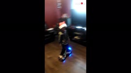 'Kid face plants on couch after dad encourages him to go faster on hoverboard '