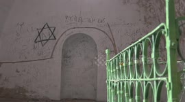 Palestinians inspect the damage of Maqam Yaqeen after being vandalized by Israeli settlers