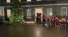 Boris Johnson flips on Christmas tree lights outside 10 Downing Street