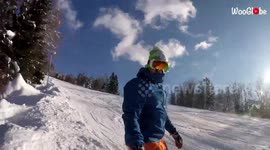 'Snowboarder face plants into snow after getting stunned by a tree branch '