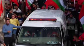 Palestinians carry the body of Mohammad Mater who was shot killed by Israeli forces, during his funeral