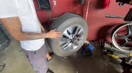 A professional mechanic balanced a tire for an car in South Florida