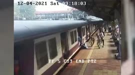 Woman falls while boarding train at railway station, rescued in western India