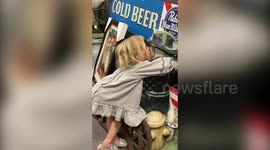 Hilarious moment US mum catches daughter secretly smooching a FIREMAN STATUE