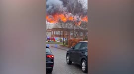 Dozens of UK firefighters fight to control an enormous blaze