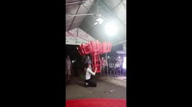 Vietnamese street act uses his mouth to lift up and balance 30 chairs