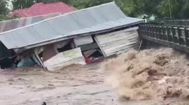 Two houses get washed away by dramatic flood in Indonesia