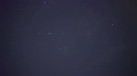 Amazing line of satellites cuts through Switzerland night sky