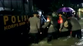Police Evacuate Flood Victims With Trucks in Makassar City