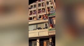 Coffee shop owner hangs dozens of teddy bears on building in support of disabled people