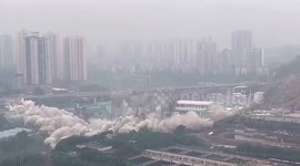 Spectacular footage shows bridge being demolished in southern China