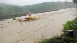 Severe flash flood carries off farm vehicle and bulldozer in Indonesia