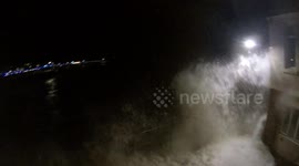 2 people caught out as waves from Storm Barra crash into St Ives seafront..