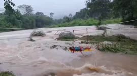 Woman saved from raging flooded river in Thailand by rescue team