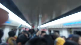 Chinese passengers on a light rail train after work in Shanghai China.