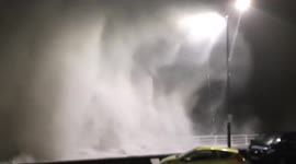 Huge waves crash over seawall onto parked cars as Storm Barra hits Wales