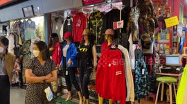 Locals buy winter jackets as temperatures fall with winter in Thailand