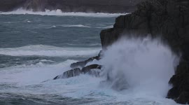 Waves whipped up by Storm Barra winds slam into cliffs in Cornwall