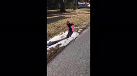 'Boy: 0, Frozen Puddle: 1 | Adorable boy slips on ice while trying to smash it
'