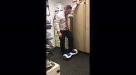 'Office worker tries to ride a hoverboard for the first time *EPIC FAIL* 
'