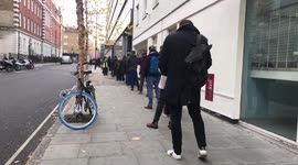 Long queues outside central London Vaccination Centre after UK Prime Minister green lights mandatory Covid Passports for England