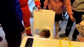 Firefighters free girl's head from chair in eastern China
