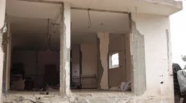 Palestinian owners of houses destroyed which destroyed on May 15 during Israeli air-strike, sit at thier house