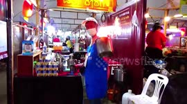 Thai street food seller’s wacky FIRE TEA attracts customers