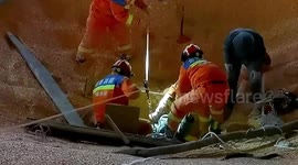 Firefighters rescue worker who fell into 20-metre-deep grain depot in northwest China