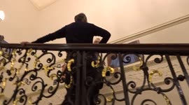 Visitors enjoy photography at Over-Seas House at ROSL 2021 competition - private view