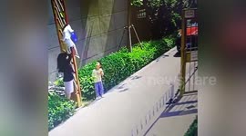 Boy lifted into air after getting head stuck in barrier gate in China