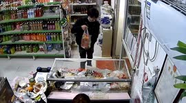 Glass counter shatters after customer lifts bag of goods up at Chinese supermarket