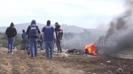 Palestinian protesters and Israeli security forces clash following a demonstration against settlements in the village of Beita in the West Bank